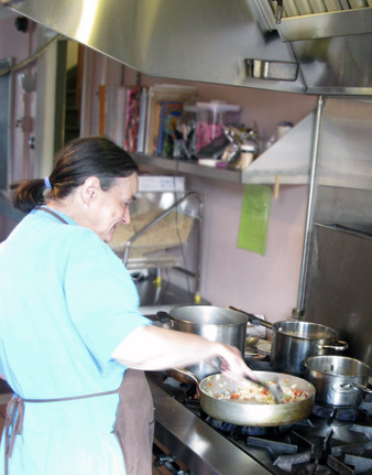 Academy House resident preparing a meal